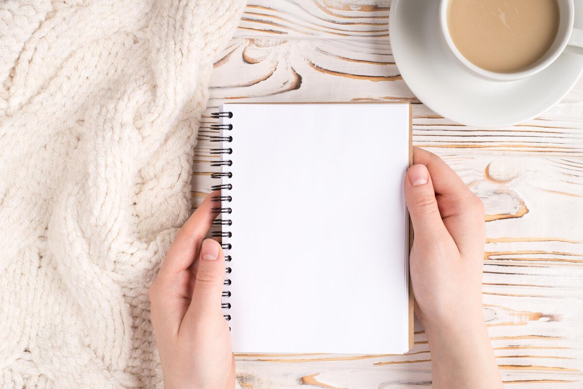 A homeschool parent planning the week with coffee and a notebook