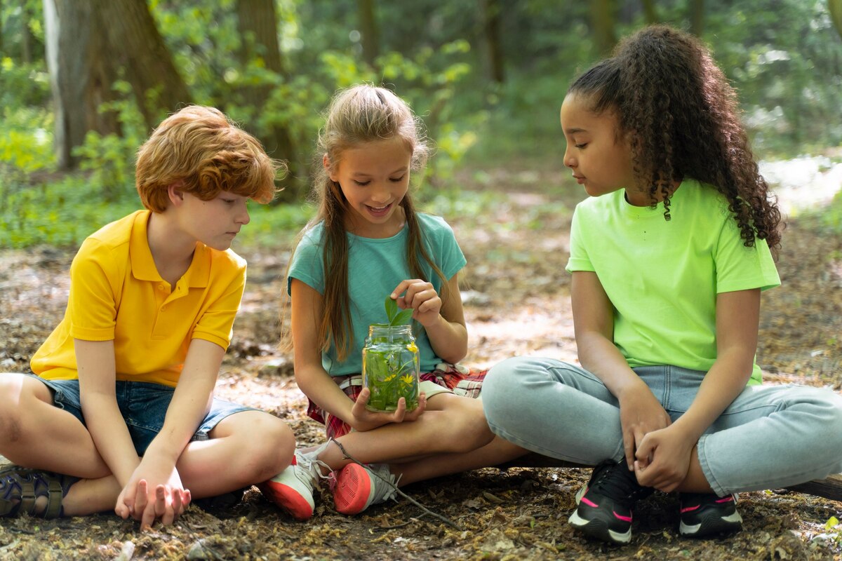 Older and younger children working together on a shared project at a homeschool co-op